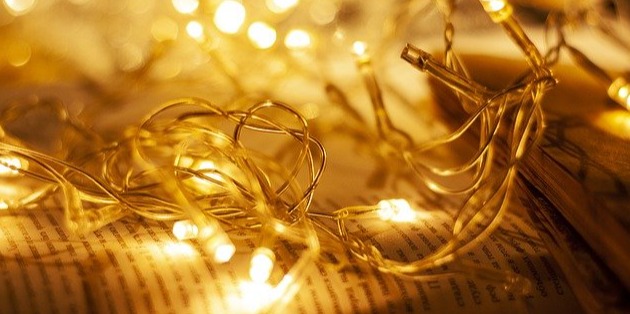 fairy lights resting on top of a book